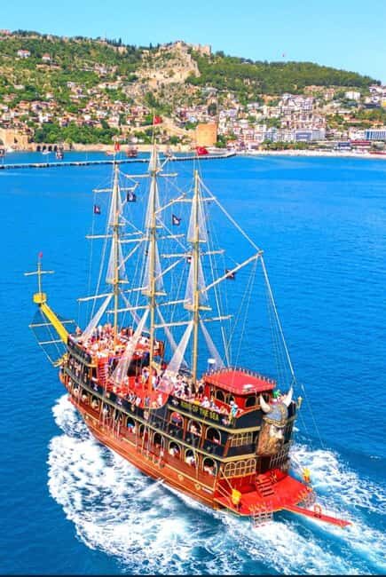 Alanya: Biggest Pirate Boat Tour with Soft Drinks and Lunch - Cleopatra Beach stop: photos, swimming, and dolphin watching
