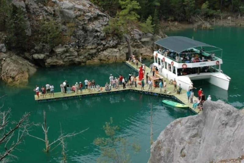 Antalya/Side: Green Canyon Day Trip with Boat Tour and Lunch - Boarding the modern catamaran: wind, cliffs, and soft drinks on deck