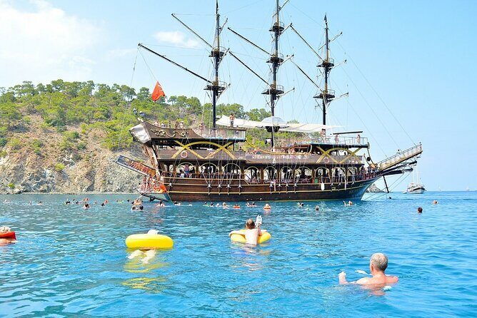 GONSTER : Luxury Pirate Boat Trip Lunch & Soft Drinks & Transfer - Boarding the ship: captain, crew, and a seat that fits your style