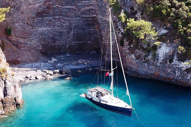 Sailing Day Tour with skipper and private chef in Kas Islands - Ufakdere Bay: clear water, a hidden sand pocket, and SUP time