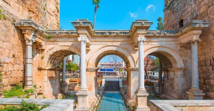 Side: Antalya City Tour With Boat Trip & Waterfall - Kaleiçi Old Town: Hadrian Gate and the Clock Tower in the same orbit